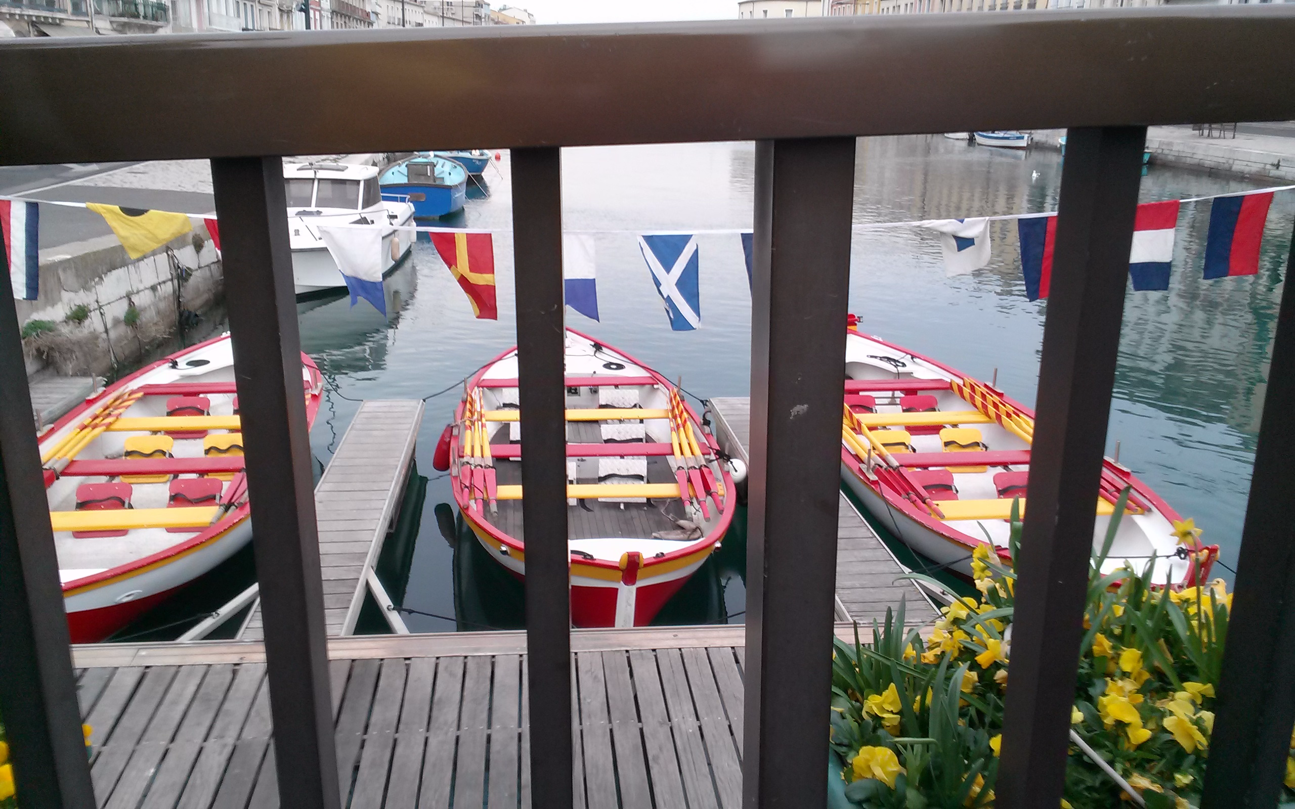 A dock with several boats in the water.