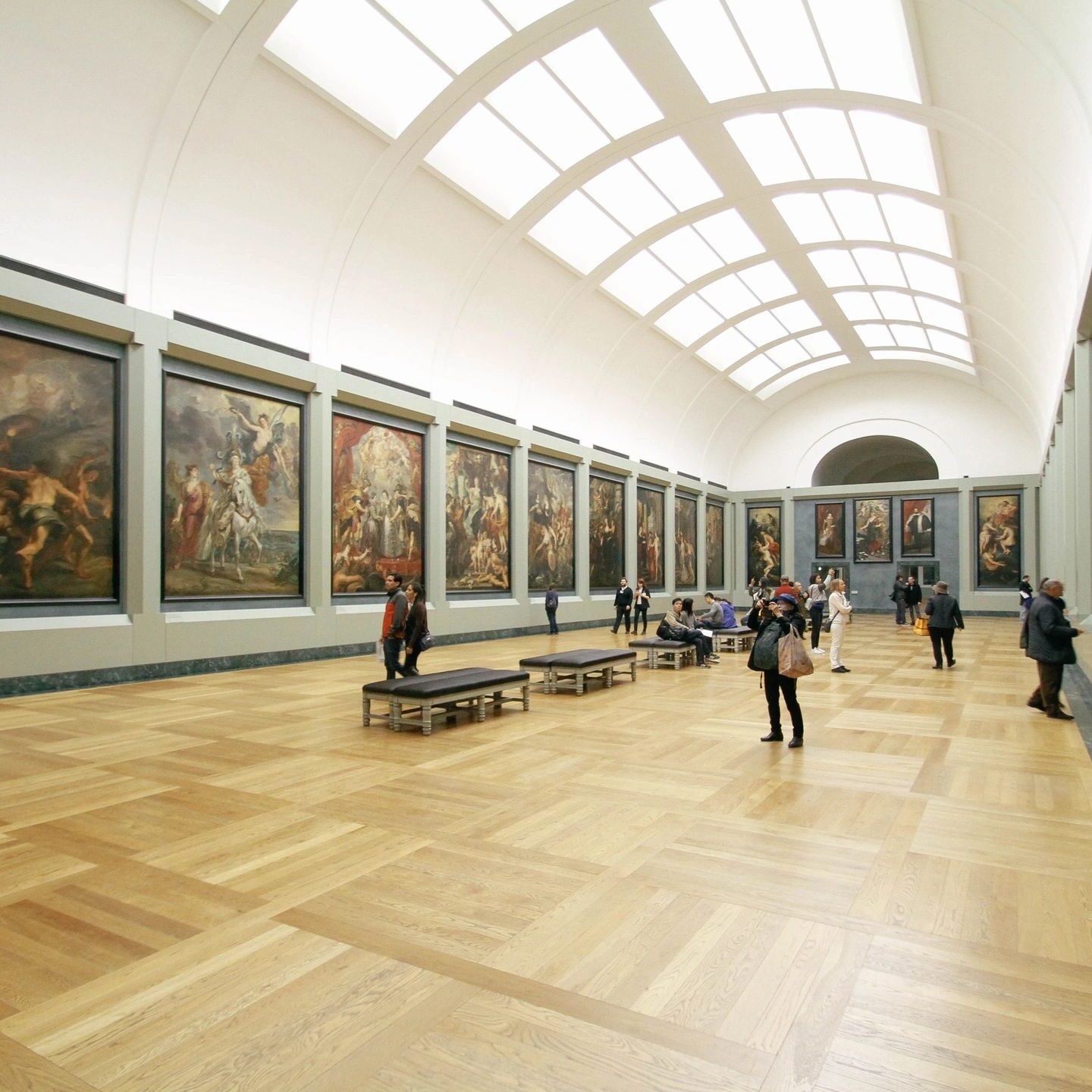 A room with many paintings on the walls